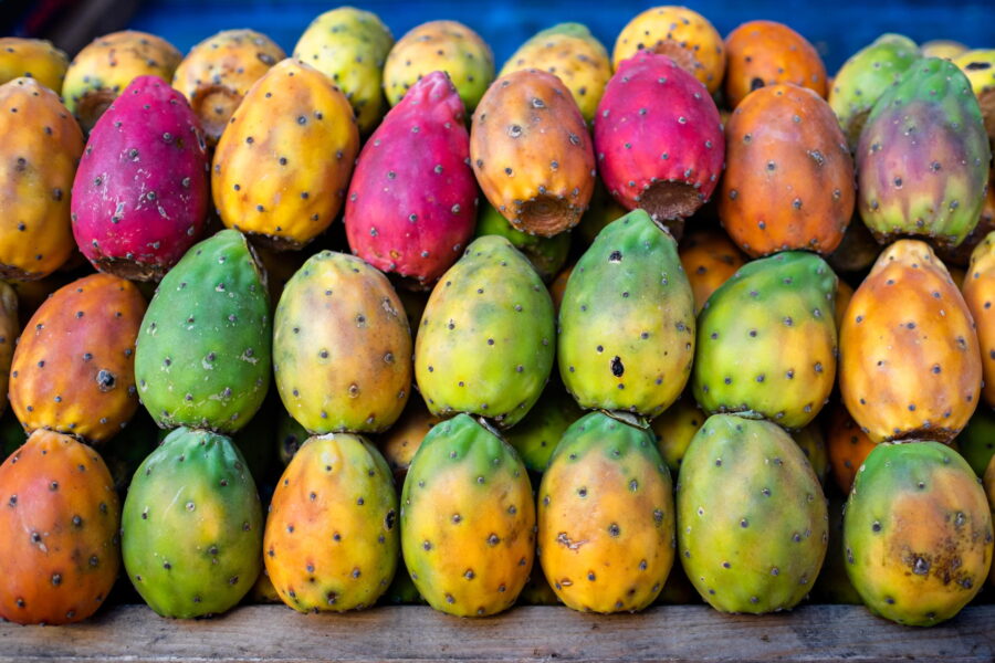 Colorful prickly pears displayed at a typical Sicilian market.