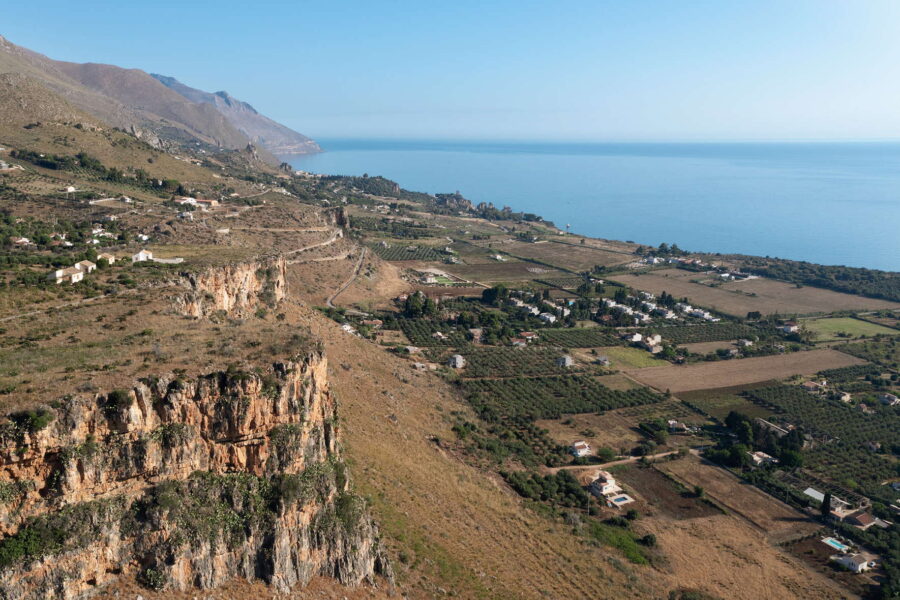 Breathtaking view from Villa Belvedere, a Sicily luxury villa with pool, overlooking the coastline, rolling hills, and lush countryside.